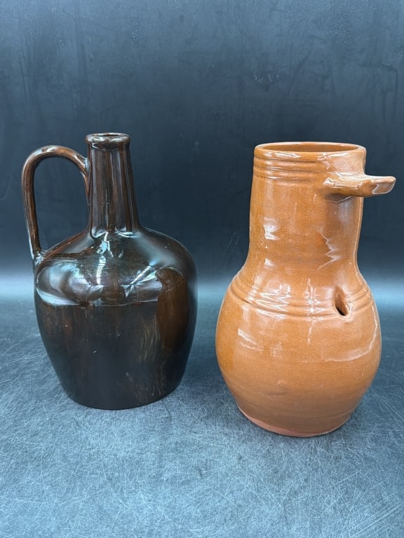 Vintage Pottery: Total of 2 pieces in this lot. There is pottery jug and pottery bird house. Condition is consistent with age and use, see pictures. Measures about 9" each. No refunds given.