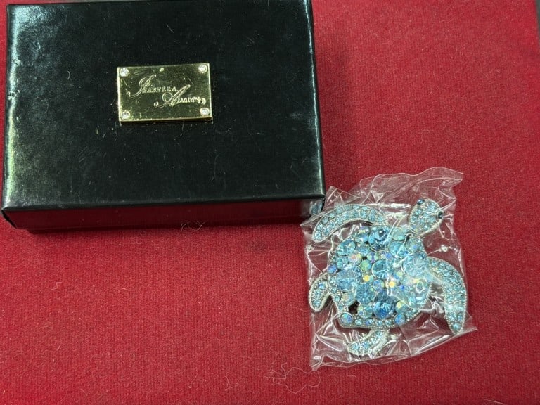 Isabella Adams Collectible Paperweight: Turtle paperweight collectible with premium crystals. Rhodium plating. Made in USA. Comes with box and condition is good, see pictures. No refunds given.