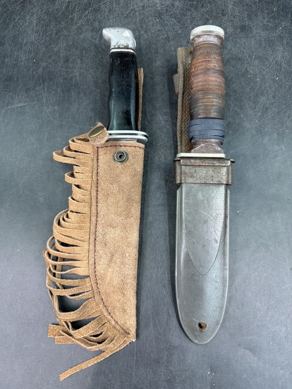 Vintage Knifes with Sheaths: One is a Buck 119 Craftsman USA and the other is hand made. Both come with sheaths and condition is good, see pictures. No refunds given.