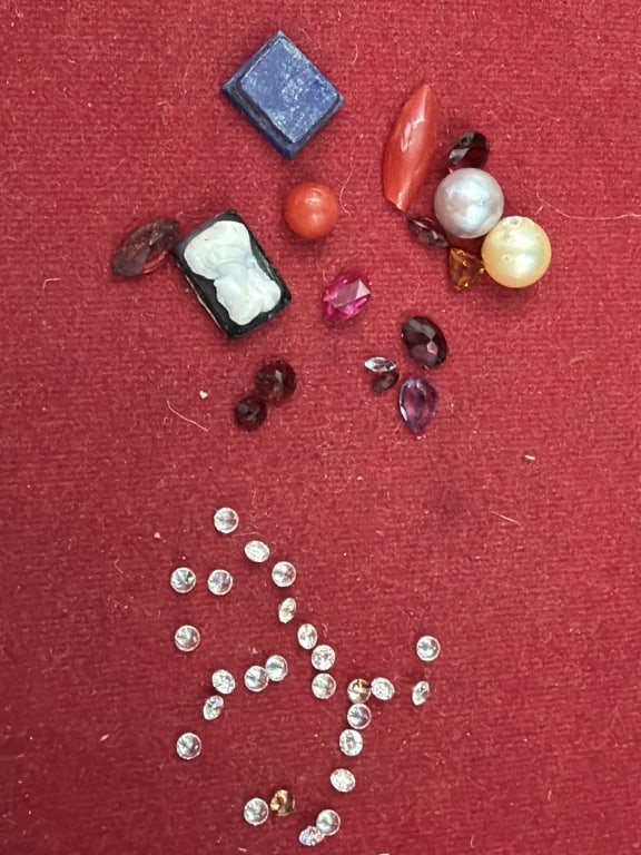 Gemstones: A mix variety of gemstones that are rubies,26 diamonds, etc. See pictures. No refunds given.