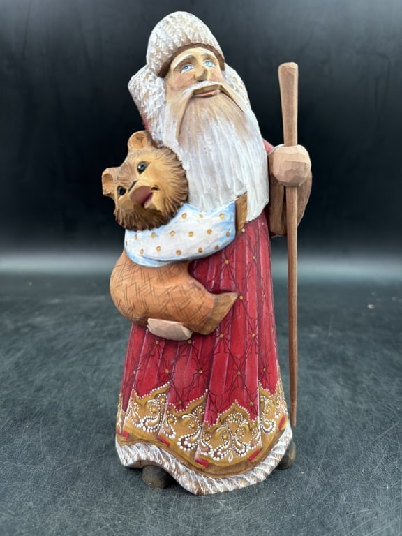 Vintage Russian Santa Claus: Traditional hand carved and hand painted Santa Claus figurine. Features Santa holding a baby bear and a wooden staff. Crafted from solid linden wood. See pictures, condition is good. No refunds