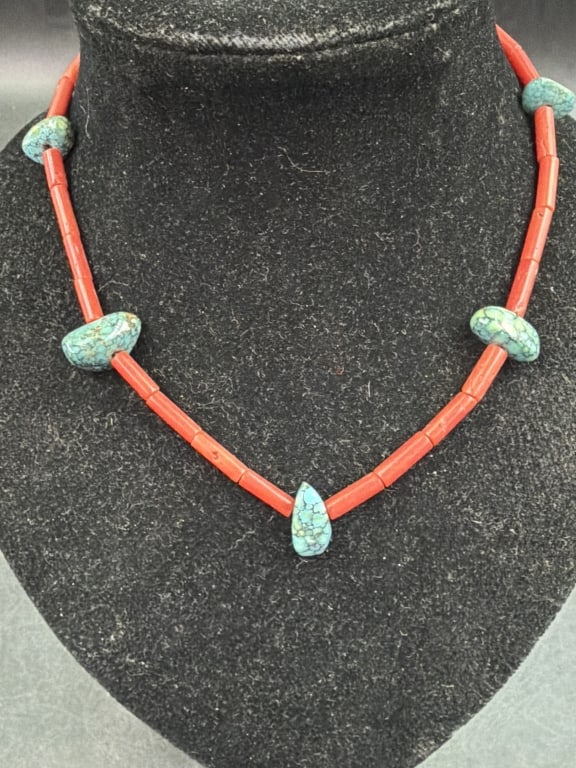 Native American Red Coral Pipes & Turquoise: Nice piece that strand is primarily composed of elongated reddish orange coral pipe beads and tubule turquoise. A single teardrop turquoise drops serves as central focal point. Condition is good, see