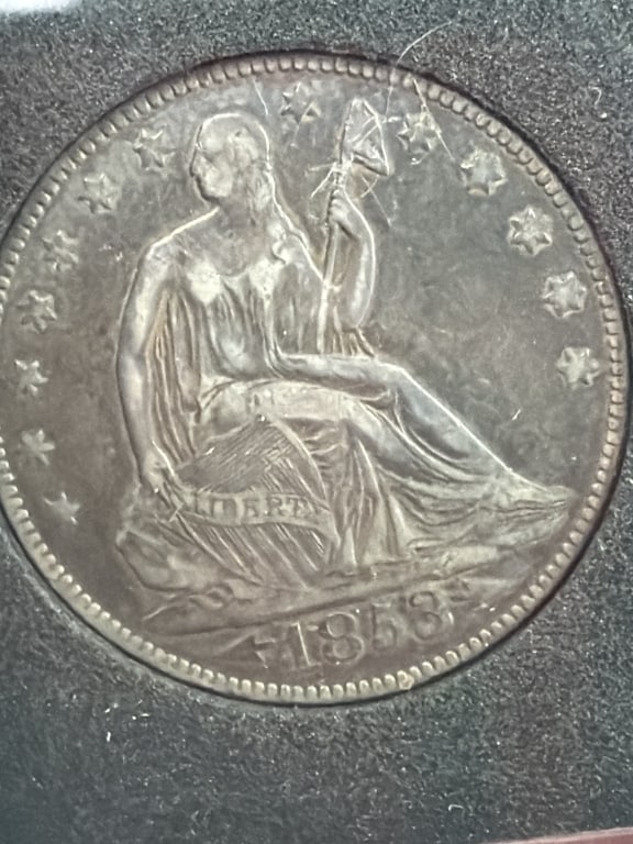 1853 Seated Liberty Half Dollar: Lady Liberty seated on a rock, holding a shield in one hand and a pole with a liberty cap in others. Condition appears good, see pictures. No refunds given.