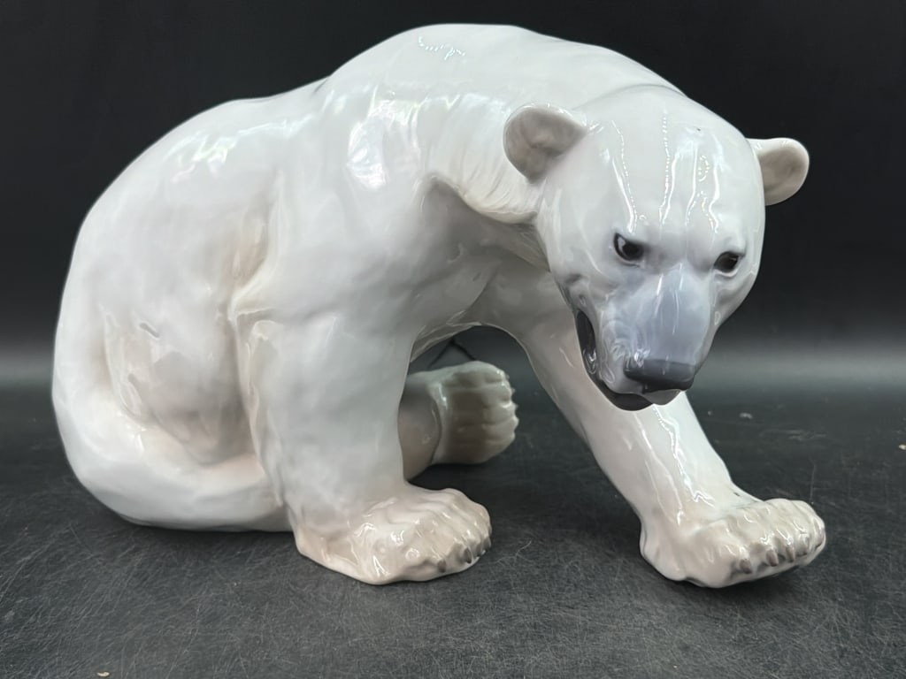 Vintage Bing and Grondahl Polar Bear 'Large': Large Polar Bear Model 1857. Designed by sculptor Knud Kyhn and made in Copenhagen, Denmark. Glazed white porcelain with subtle underglass tones. Measures about 8" x 13" x 7". Condition is good, see