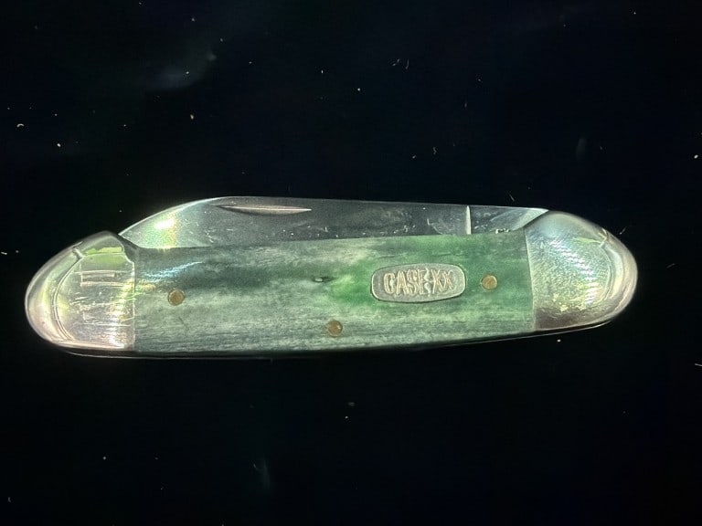 Vintage Case XX: Vintage green bone handled folding pocket knife. Features green colored bone handle scales with a metal shield inlaid in the center. Condition is consistent with age and use, see pictures. No refunds