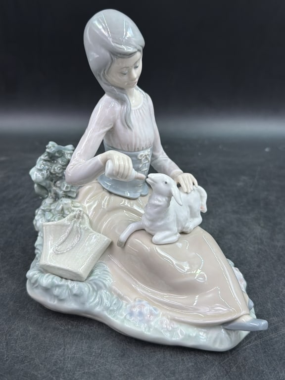 Lladro 'Little Bo Pee' Figurine: Depicts a young girl feeding a lamb. Has stamp on bottom and glossy glaze porcelain. Measures 6.5" x 7" x 5". Condition is good, see pictures. No refunds given.