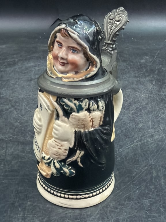 Antique German Figural Stein: Produced 1900's to 1920's/ Crafted from glazed ceramic with metal hinged lid. Measures about 4". Marked on the bottom, see pictures. Condition is good. No refunds given.