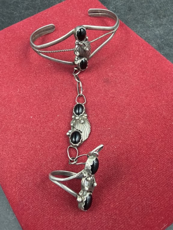 Sterling Silver Slave Bracelet: Native American Navajo sterling silver and black onyx slave bracelet. Weighs 16.3g and ring is a size 4 1/2. Condition is good, see pictures. No refunds given.
