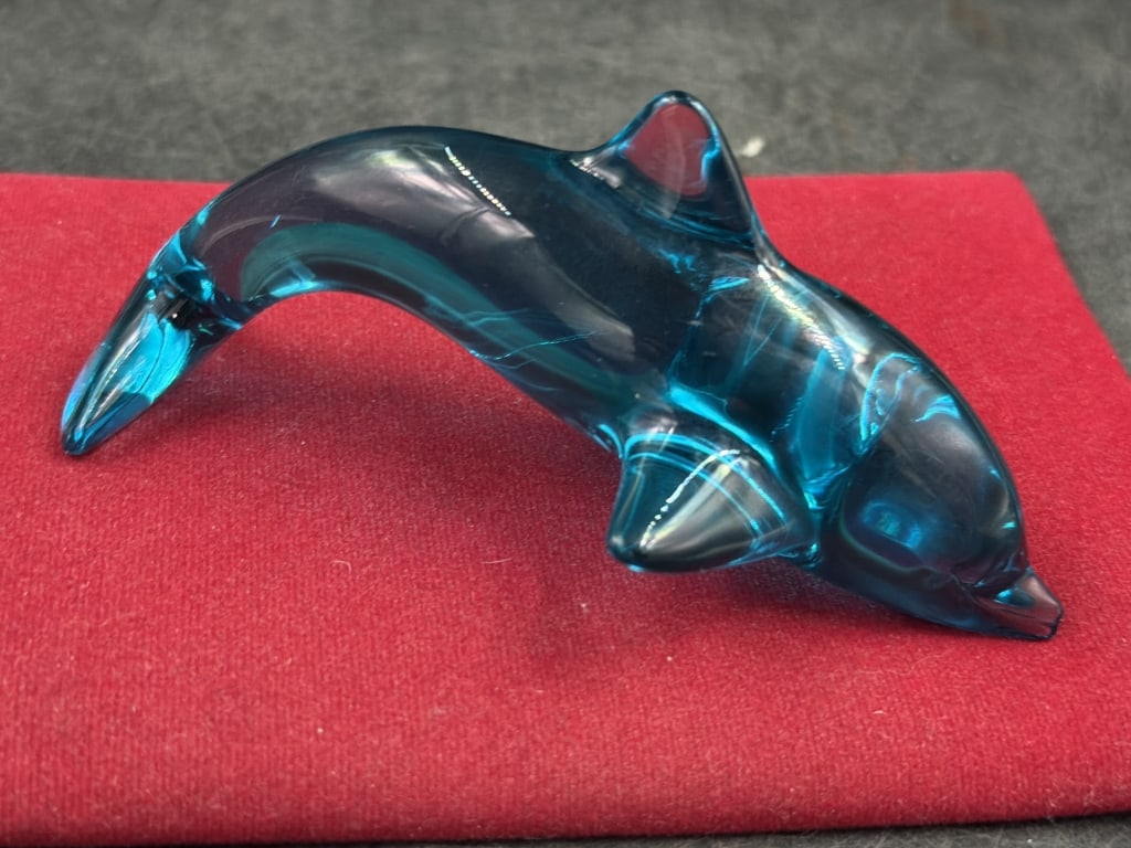 Daum France Dolphin: Measures about 5" l and condition is good. Piece is marked Daum France. Sleek crystal figurine featuring a deep blue hue that creates a luminous display. Condition is good, see pictures. No refunds