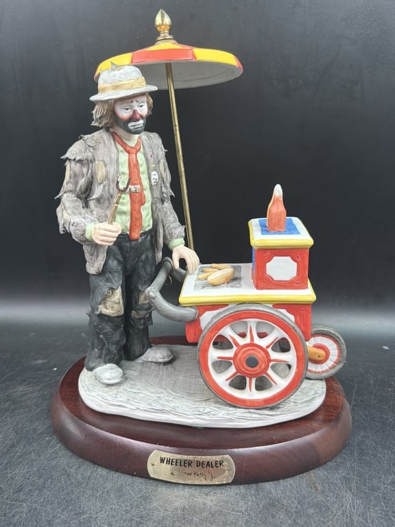 Emmett Kelly 'Wheeler Dealer' Figurine: Clown with red tie and white hat pushing yellow food cart with umbrella. LE#1189/7500. Condition appears good, see pnictures. No refunds given.