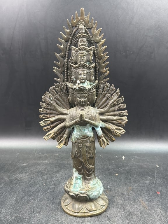 Brass Avalokiteshvara Statue: Often called the "Thousand Armed Buddha". Originates fro Tibetan and features multiple heads arranged vertically and numerous arms spreading out behind the central figure in a mandala shape. Measures