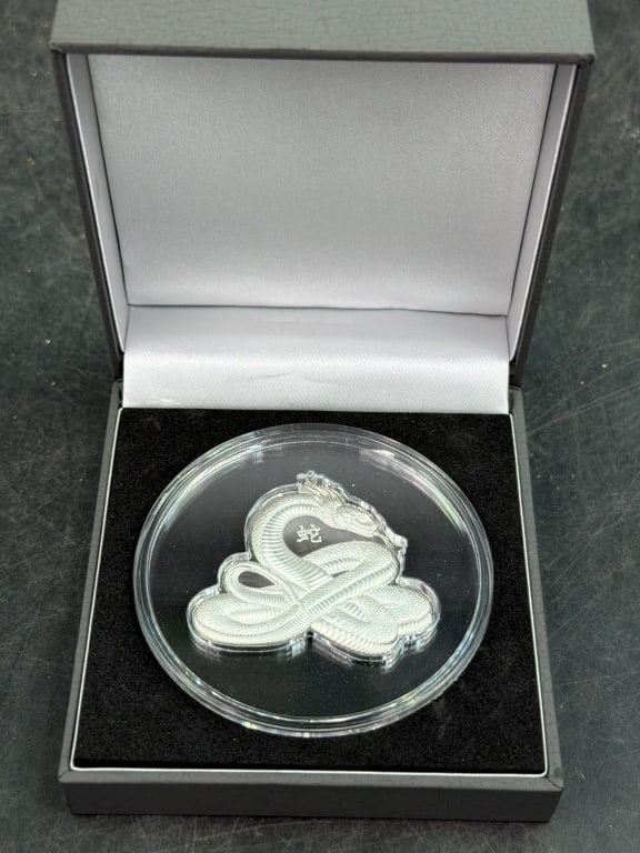 2025 Cameroon Lunar Snake Shaped Silver Coin: Year of the Snake 2025 1 Troy Oz Coin. Comes in original box . Encapsulated and in display box. Condition is good, see pictures. No refunds given.