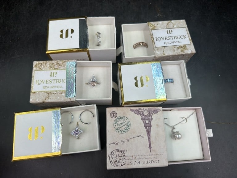 Sterling Jewelry: Total of 5 rings and 1 necklace with pendant. All in original boxes (Love Stuck, Bomb Party). Condition is good, see pictures. No refunds given.