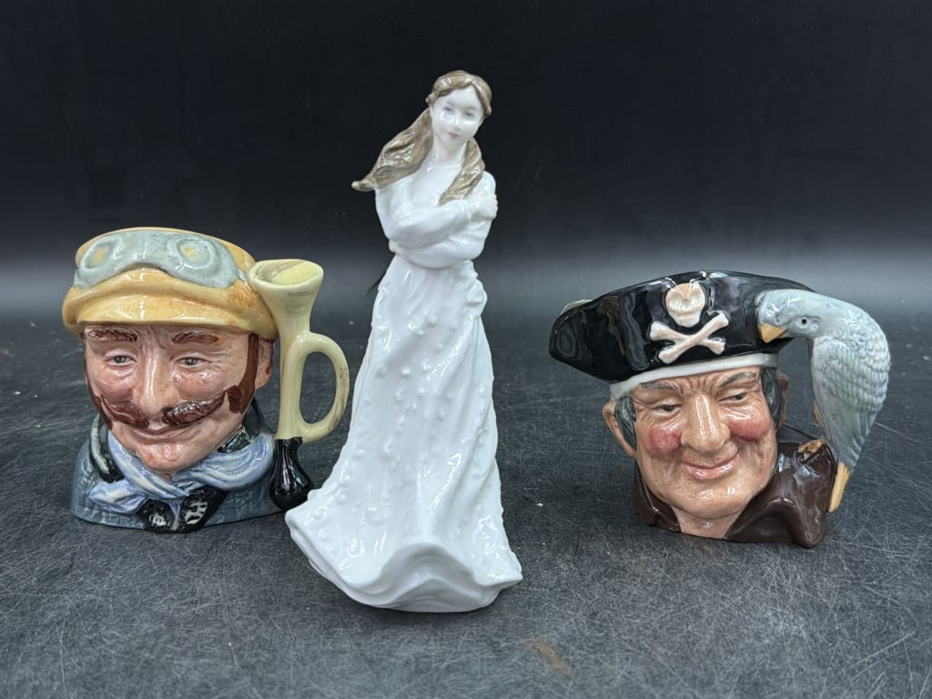 Royal Doulton Lot: Total of 3 pieces. There is a figurine "Embrace" and 2 Toby mugs. See pictures, condition is good. No refunds given.