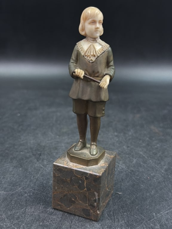 Art Deco Chryselephantine Sculpture: Bronze statue with carved head and gemstone eyes. Measures about 5 1/4" h and condition is consistent with age, see pictures. Circa 1920's to 1930's. No refunds given.