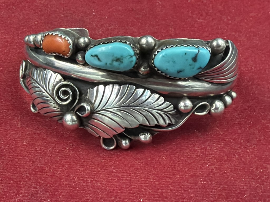 Phil Chapo Navajo Sterling Botanical Cuff Bracelet: Sterling silver, turquoise and coral. Botanical leaf details and silver beads. Marked and weighs 31.8g. Measures inside 5". Condition is good, see pictures. No refunds given.