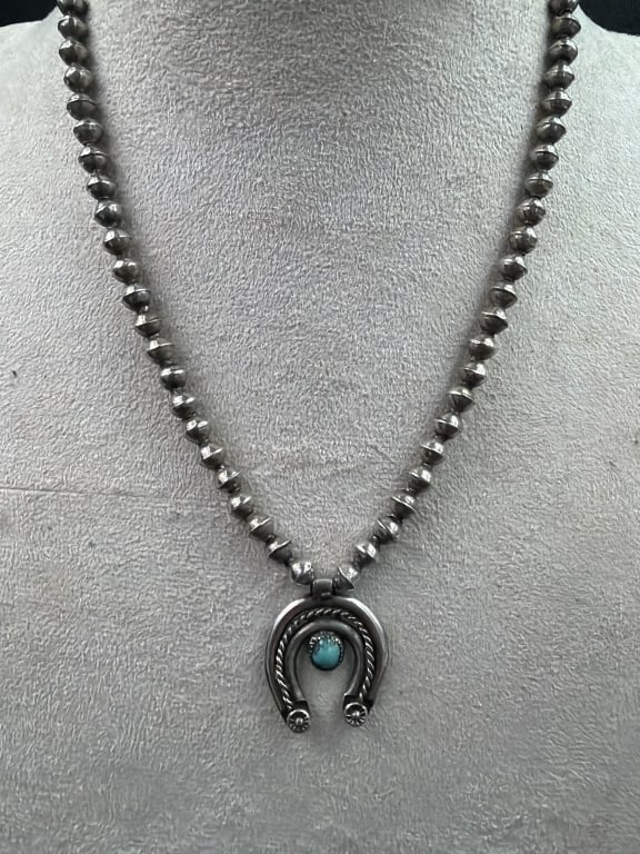 Navajo Naja Sterling Necklace: Pendant is crescent shaped "naja" and paired with traditional Navajo pearl beaded chain (14"). Condition appears good. See pictures. .0 Total weighs is 12.6g. No refunds given.