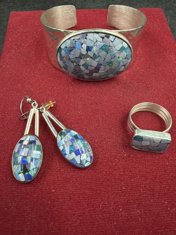 Sterling Opal Jewelry Set: Silver and inlaid with pieces of opal to create mosaic effect. There is dangle earrings (2"), ring (size 8) and cuff (5.5 inside diameter and stone is 1 1/4" x 1 3/4"). See pictures, condition