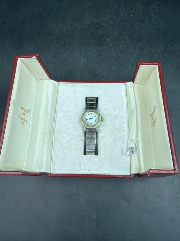 Vintage Cartier Santos Octagon Watch: Two toned design of steel and 18kt good. Unique octagonal bezel and signature exposed screw accents on bezel and bracelet. In original box some wear on box, see pictures. Condition consistent with