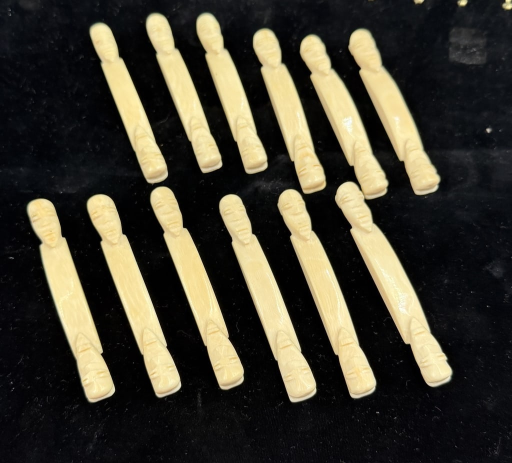 Tupilaq Tribal Art Figures (Greenland): Primitive figures of faces on both ends of a central bar. Total of 12 pieces measures4", see pictures. Condition is good, no refunds given.