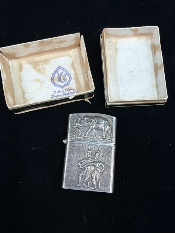Siam Sterling Lighter with Original Case: Features embossed elephant on one side and traditional Thai dancers on the other. See pictures, condition appears good. No refunds given.