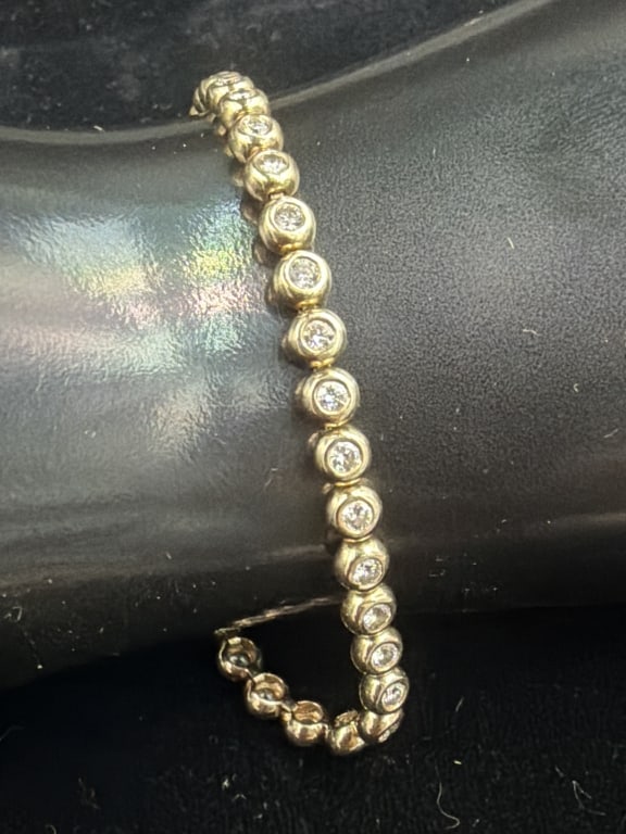 Beautiful Channel Set 14k Gold Diamond Bracelet.: Diamonds estimate are .5/6 each. Great shape. See pictures, weighs 12.4g. Condition appears good. No refunds given.