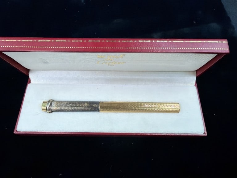 Cartier Gold Filled Pen with Original Box: Les Must de Cartier Vendome Trinity ballpoint pen. Made in France. Pen measures 5.25" long and box is 7" x 2.5". See pictures, condition consistent with age. No refunds given.
