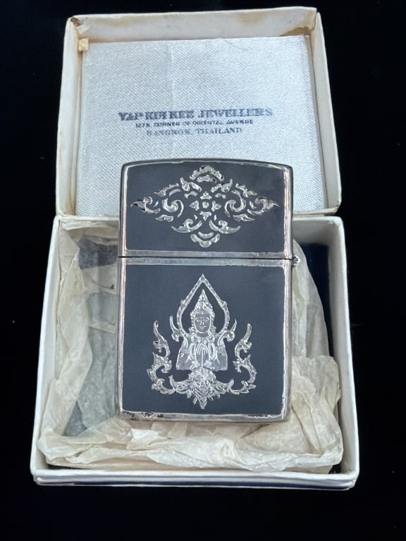 Vintage Siam Sterling Silver Lighter: Comes with original box. Intricately engraved scenes of traditional Thai elephant warriors and ornate flourishes.