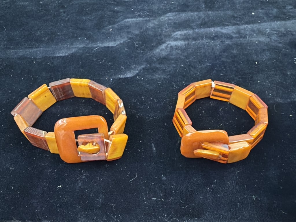 Vintage Art Deco Bakelite Stretch Bracelets: Total of 2 in this lot that are amber colored marbled bakelite links and belt buckle design. Condition consistent with age and use, One needs restrung. see pictures. No refunds given.