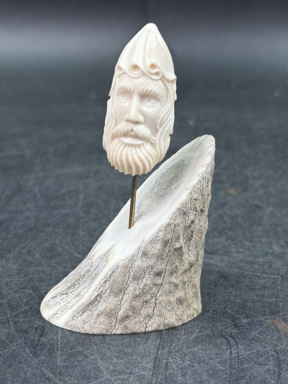 Carved Tooth with an Antler Base.: Neat piece that measures 3.5". Condition appears good, see pictures. No refunds given.