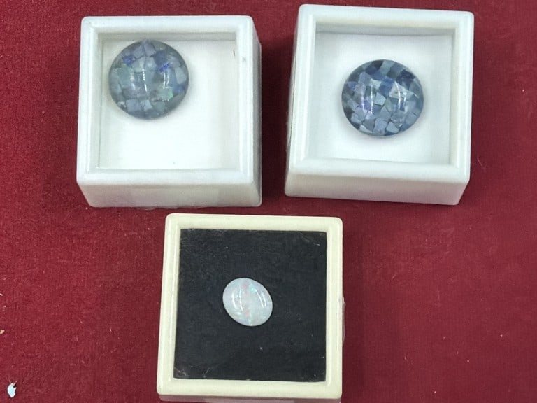 Gemstones: Total of 3 opals in protective cases. There is a Australian opal and the other 2 are Mosaic opals. See pictures, condition appears good. No refunds given.