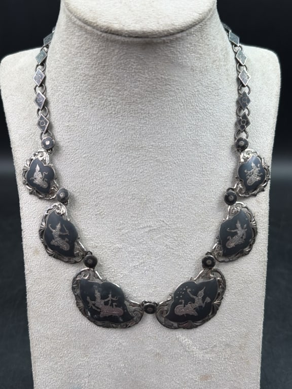 Siam Silver Niello Jewelry: Features silver panels with black oxidized engravings of mythological figures. Piece is marked Siam Silver. Weighs 44.1g and condition is good. See pictures, no refunds given.