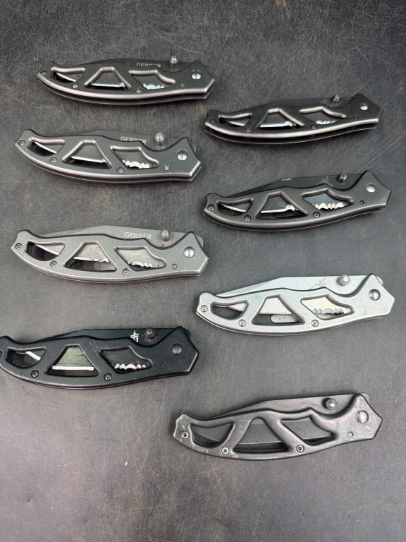Gerber Paraframe Pocket Knife: Features skeletonized handle frame. Total of 8 in this lot, see pictures. Condition appears good. No refunds given.