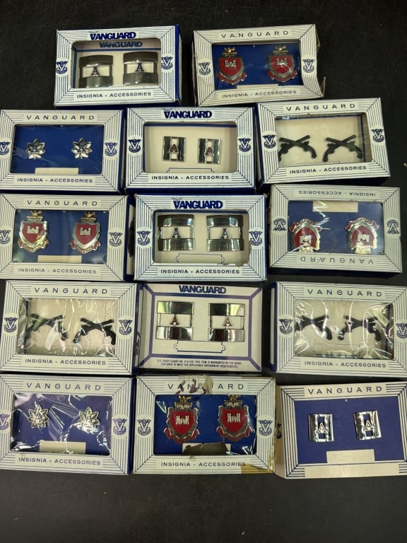 Vintage Vanguard Miliary Insignia Accessories: Total of 14 and 12 in boxes and 2 are on cardboard backs. See pictures, condition appears good. No refunds given.