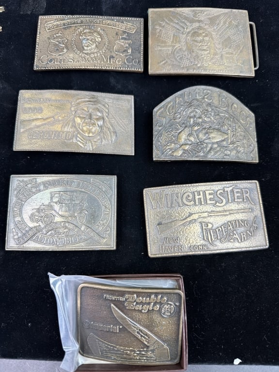 Vintage Brass Belt Buckles: Total of 7 and 1 has original box. There is a variety from Ford, Colt, Winchester, etc. See pictures, no refunds given.