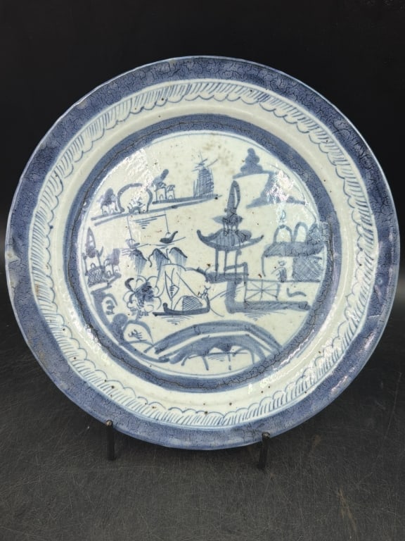 Antique Chinese Porcelain Plate: 19th century Canton blue and white export piece, featuring hand painted village scene. Pagodas, bridges and mountain landscape under blue glaze. Measures 10" and condition is consistent with age, see 