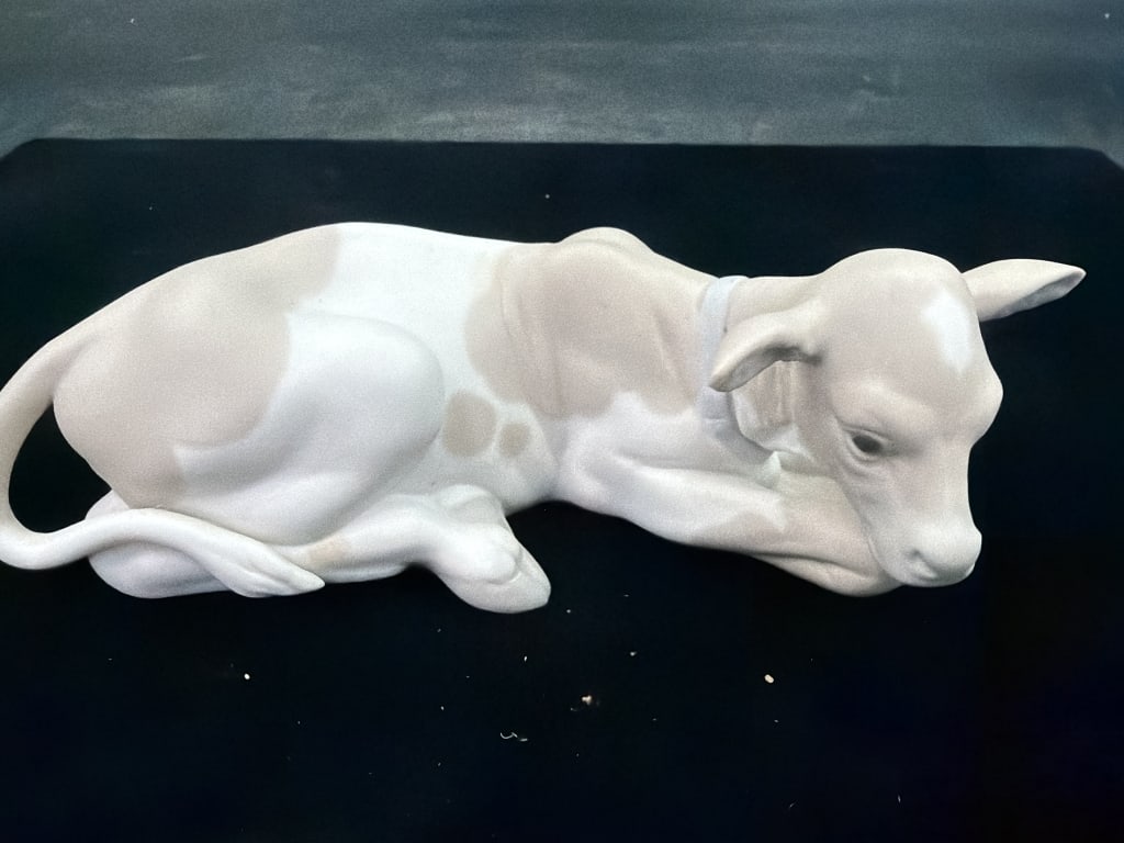 Lladro "Calf Figurine": Matte porcelain finish. Measures 2.5" x 6.5". Condition is good, see pictures. No refunds given.