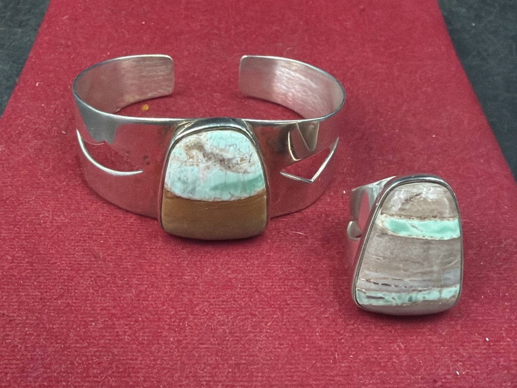 Artisan Crafted Sterling Cuff and Ring: Marked DTR (Desert Rose Trading). Weighs together 53.1g. The ring is a size 7 and condition is good, see pictures. Cuff inside is 5.5". No refunds given.