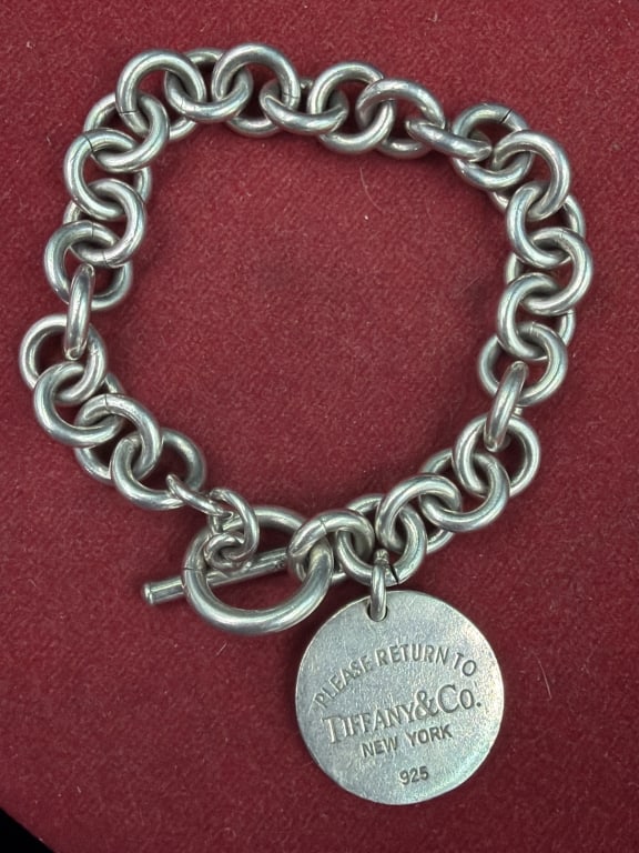 Tiffany & Co "Return to Tiffany" Sterling Bracelet: This is a round tag toggle bracelet. See pictures, condition appears good. Weighs 53.0.g. No refunds given.