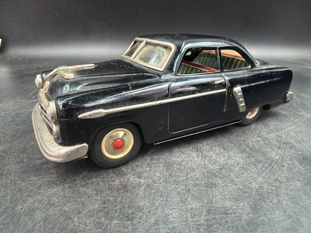 Vintage 1950's Minister Delux Tin Friction Toy Car: Made in Japan. See pictures, condition is consistent with age and use. No refunds given.