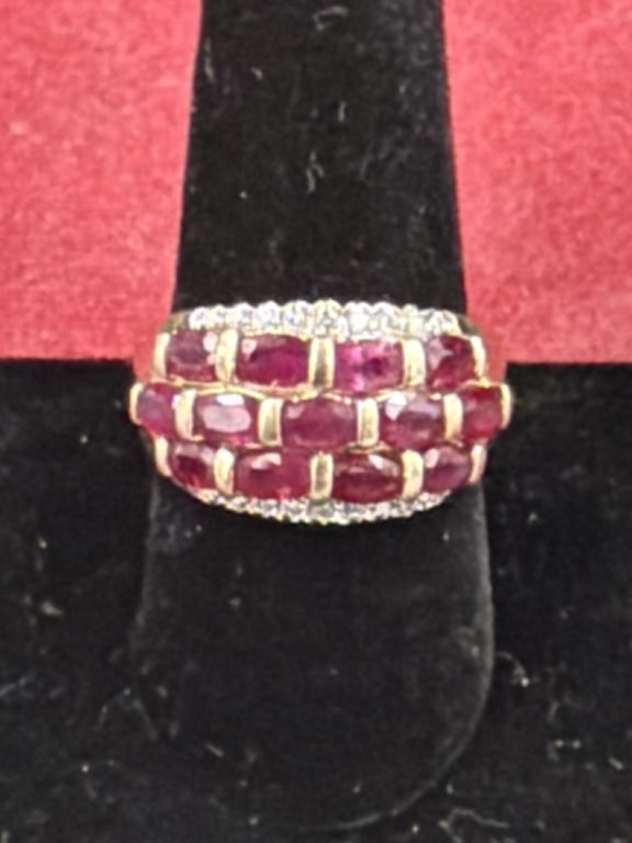 10kt Gold Ring with Rubies: Nice 10k t yellow gold cocktail band featuring three rows of oval cut rubies and scallop of pave diamonds. Weighs 7.2g and size 9.5. Condition is good, see pictures. No refunds given.