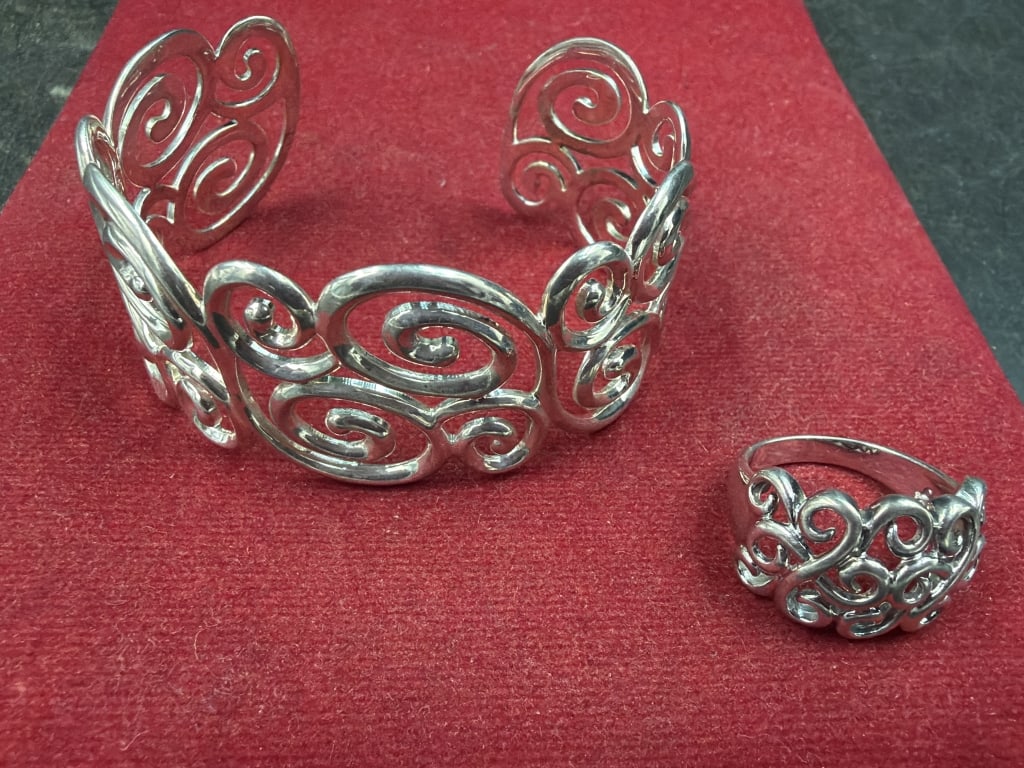 Sterling Ornate Openwork Cuff Bracelet with Ring: Ross Simons Intricate cut out scroll and swirl design. Weighs 34.2g and condition is good, see pictures. Ring is a size 7.5 and cuff measures 5". Condition is good. No refunds given.