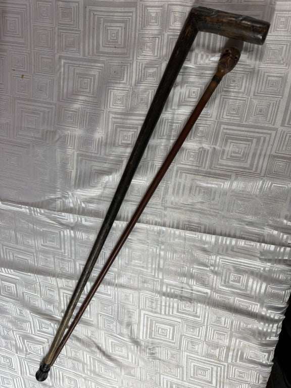 Folk Art Canes: One has a distinct L shaped handle and other a carved bulbous head. They measures 32.5" and 35.5" and both are hand made. See pictures, no refunds given.