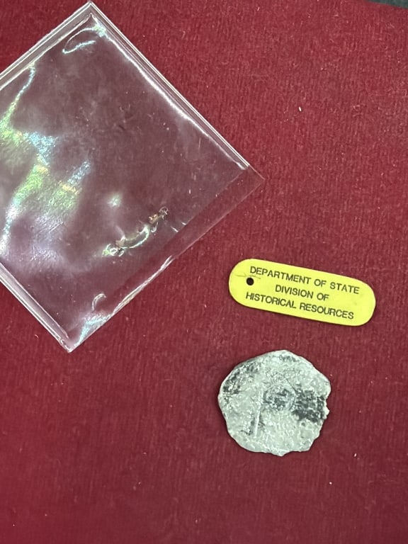 Ship Wreck Coin: Tag states Department of State Division of Historical Resources. Coin is 1 or 2 reales? See pictures, No refunds given.