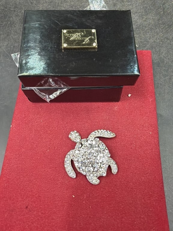 Isabella Adams: Comes in original box and has clear rhinestones and large accent stones. Condition is good, see pictures. No refunds given.