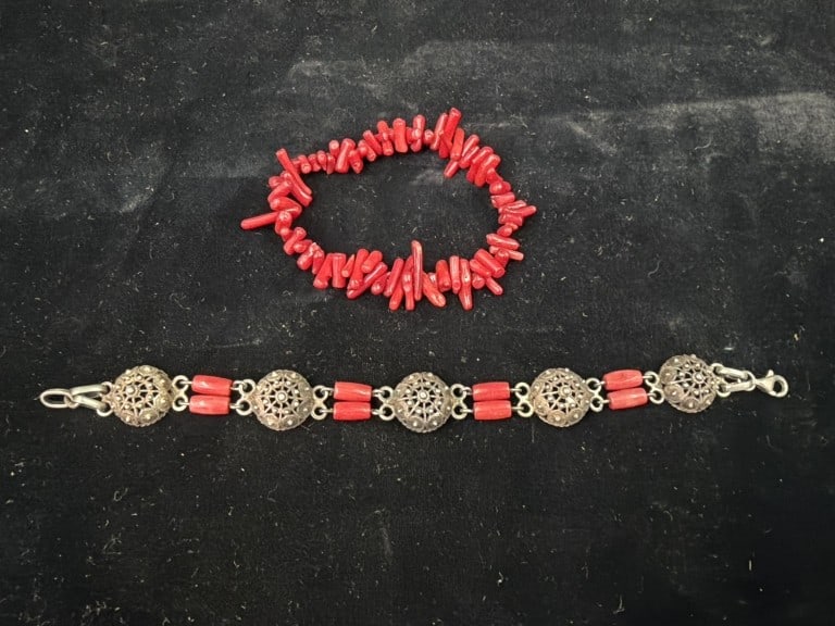 Red Coral Jewelry: One bracelet is sterling silver and natural red coral bracelet with ornate filigree metalwork. The other red branch coral bracelets, twig like segments strung together. Condition appears good, see