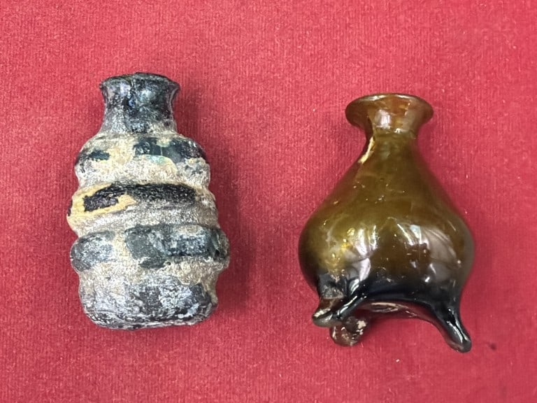 Antique Bottles: One is a Ancient Roman British or Frankish glass bottle with heavily weathered iridescence and encrusted patina. The other is a vintage hand blown amberina glass bottle. Teardrop form and gradient