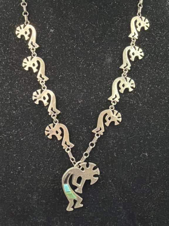 Southwestern Sterling Kachina Dancer Necklace: Linked chain of kokopelli flute player charms. Signed on the back. Measures overall 13" when worn. Kachina pendant is 1 3". Condition is good, see pictures. Total weight is 39.3g. No refunds given.