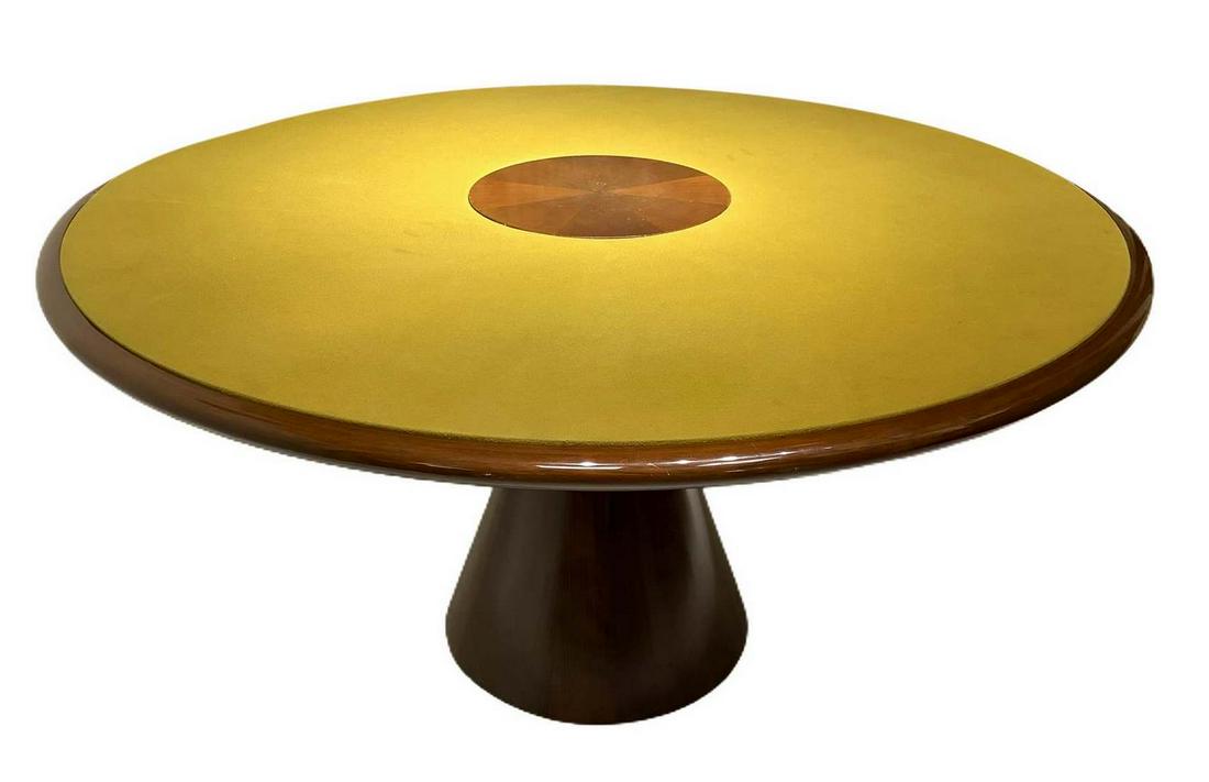 Italian Production in the style of Angelo Mangiarotti.: Italian Production in the style of Angelo Mangiarotti. Important table with wooden frame veneered walnut and glossy finish. Foot conical trunk and round top coated cloth in shades of mustard. Wear and