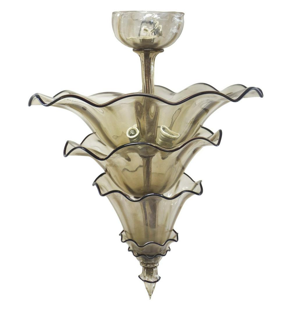 Transparent Murano glass chandelier, 1930s: h 66 cm x 51 cm Conical trunk with overlapping planes with dark edges.
